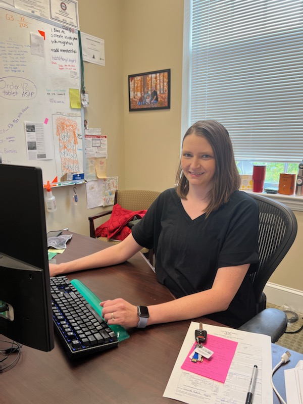 Amanda Lukach at her desk