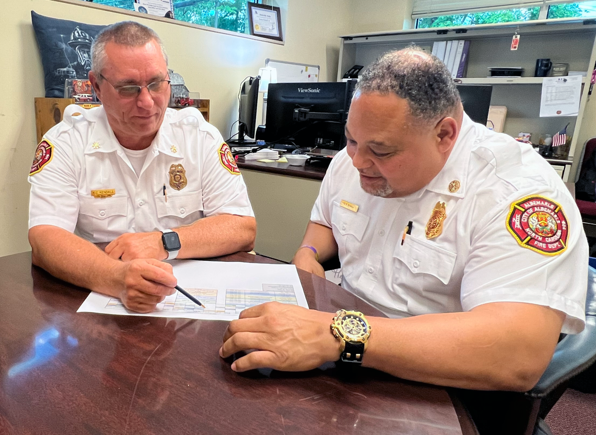 Asistant Fire Chief Kenny Kendall meets with fire chief